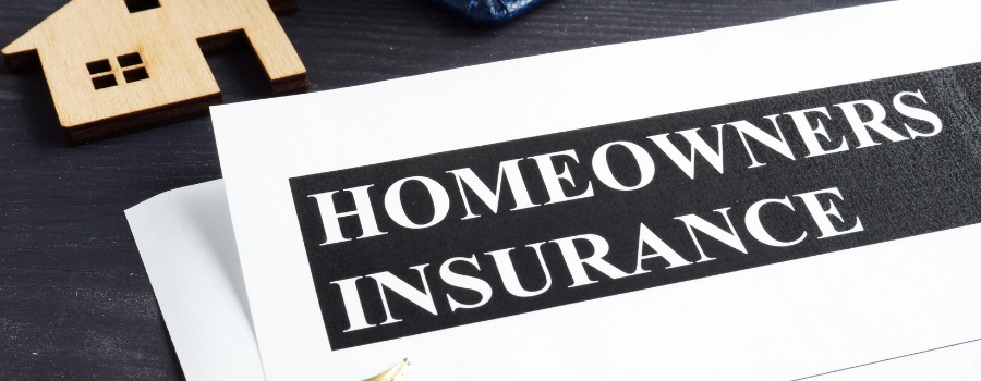 Homeowner reviewing canceled insurance notice in Auburn, Alabama